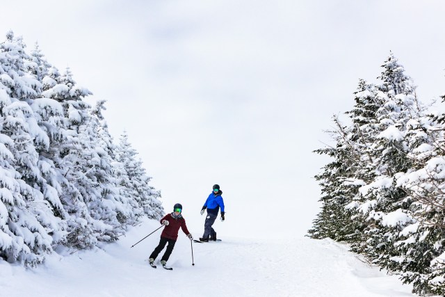 adventurous engagement session skiing down the mountain